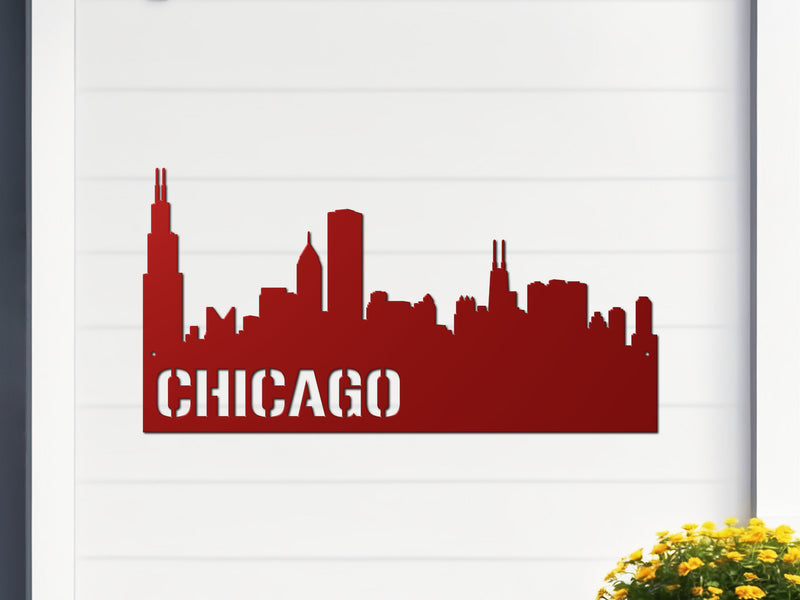 Red metal sign of Chicago skyline with 'CHICAGO' text on a white 