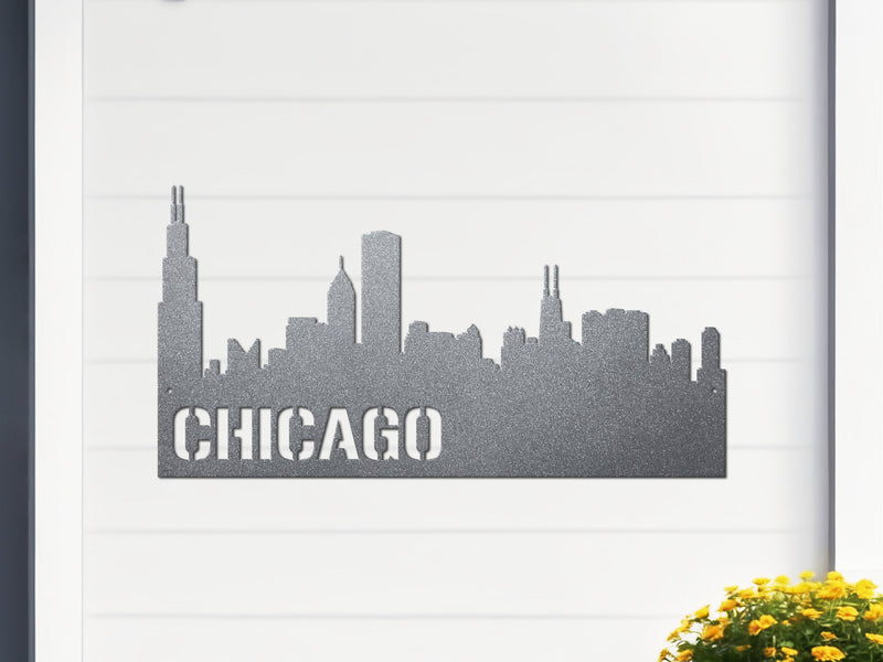 Silver metal sign of Chicago skyline with 'CHICAGO' text on a white 
